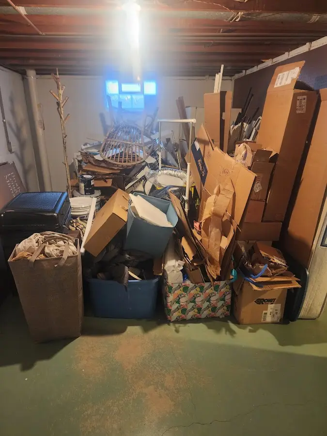 Roll-off dumpster container at job site for Yard Waste Dumpster Rental in Naples Manor